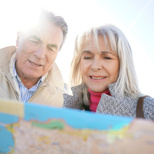 senior couple looking at a map
